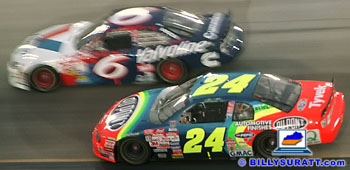 Mark Martin passing Jeff Gordon at a NASCAR race.